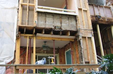 Condo balcony stripped down revealing termite damage